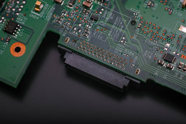 istock Part of an electronic printed circuit board with many electrical components. 1357948149