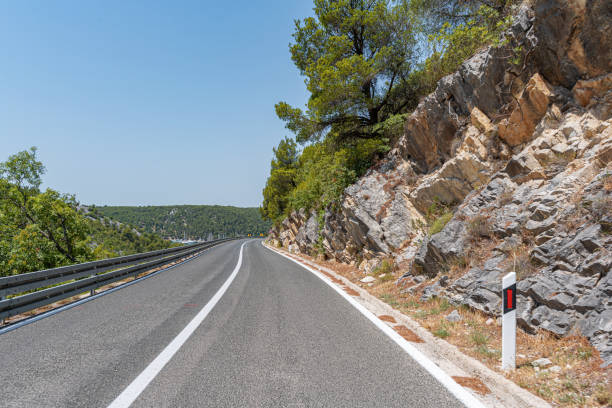 istock A road with sharp turns in the mountains. 1357948375