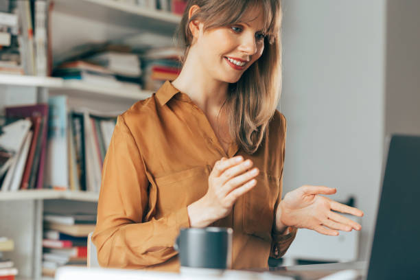 istock Cheerful Businesswoman Talking on Video Call Meeting 1357948430