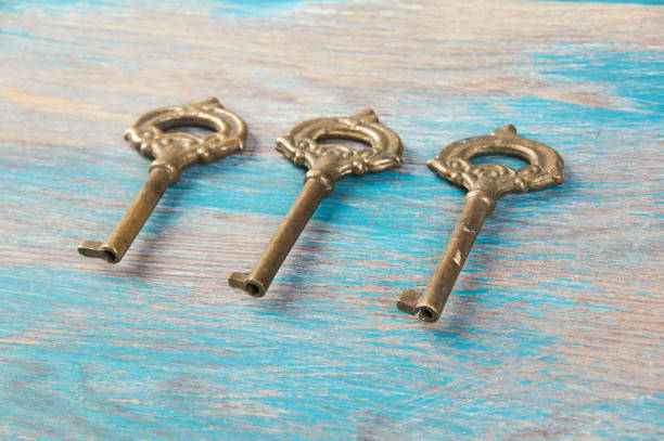 istock Old meal keys on wooden background 1357948450