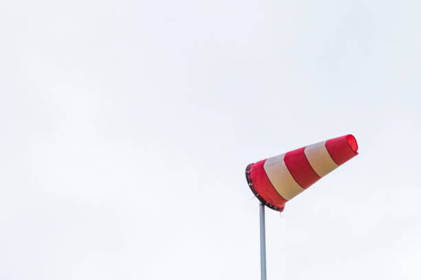 istock Windsock determining the direction and strength of wind speed 1357949903
