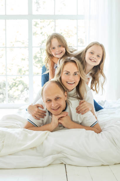 istock Happy family having fun time at home 1357952630