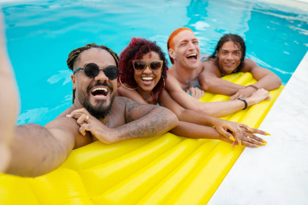 istock Friends taking a selfie in the pool 1357954364