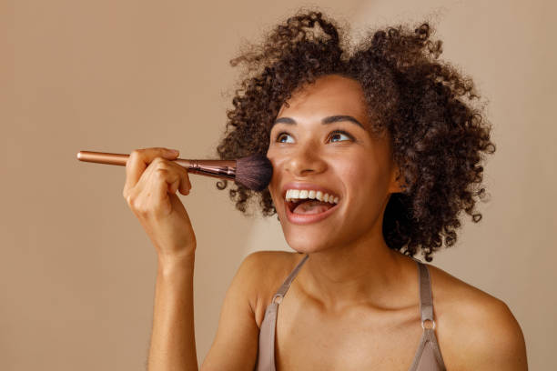 istock Charming multiracial woman posing against beige wall 1357956369