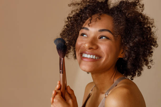 istock Charming multiracial woman posing against beige wall 1357956370