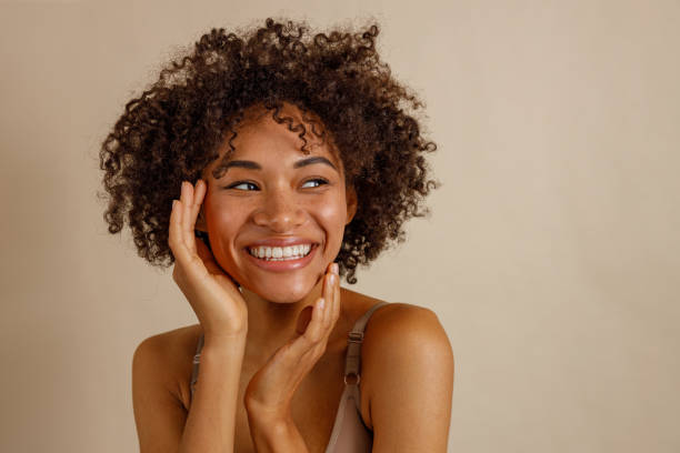 istock Attractive multiracial woman posing at camera over beige background 1357956378