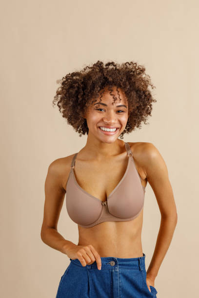 istock Attractive multiracial female posing at camera over beige background 1357956400