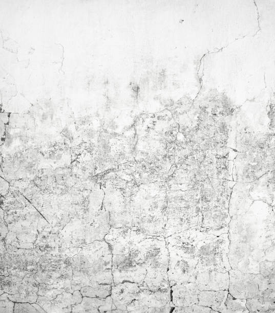 Old gray cracked spotted grunge wall texture background