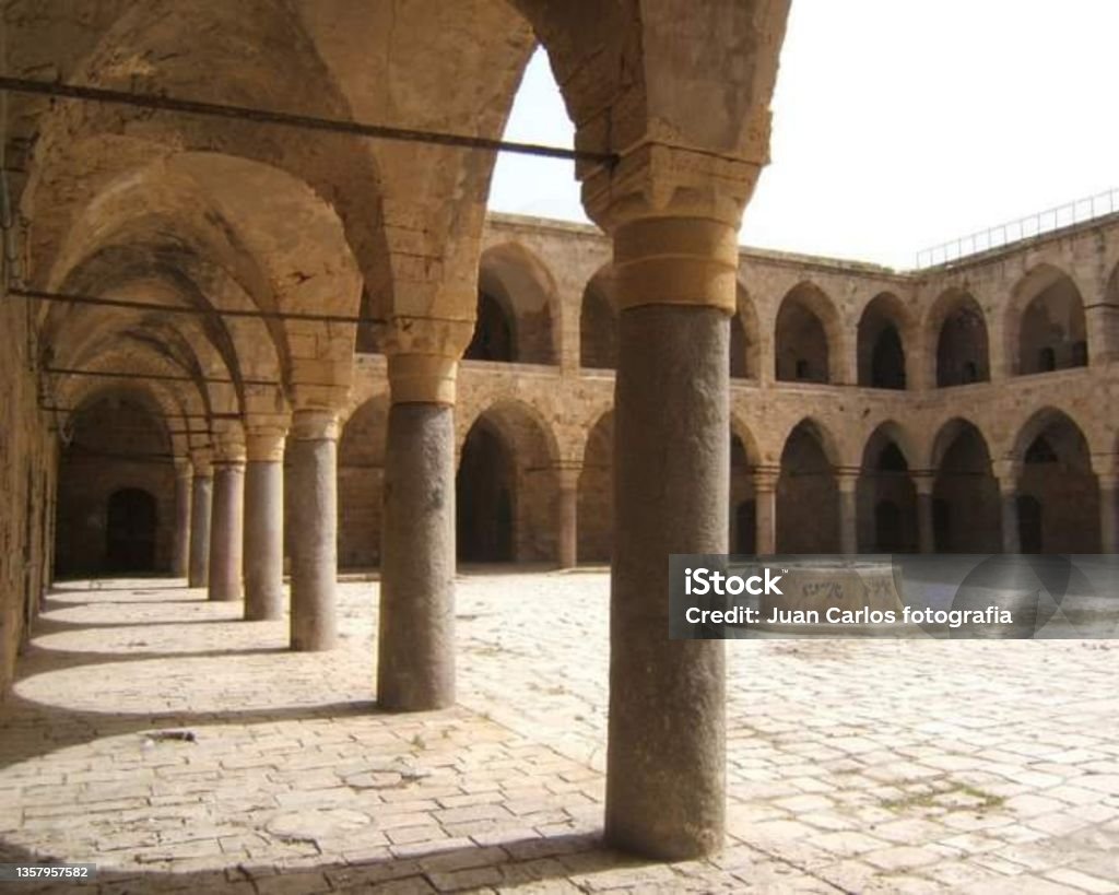 The Khan al-Umdan "caravanserai of the pillars" or "inn of the columns", also known as Khán-i-'Avámid), Acre, Israel The Khan al-Umdan caravanserai of the pillars" or "inn of the columns", also known as Khán-i-'Avámid), Acre, Israel Acco Stock Photo