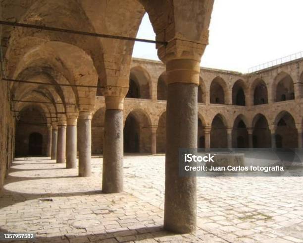The Khan Alumdan Caravanserai Of The Pillars Or Inn Of The Columns Also Known As Khániavámid Acre Israel Stock Photo - Download Image Now