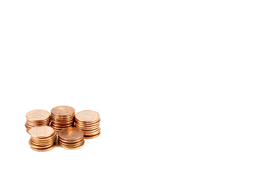 A stack of 26 money coins on white background with clipping path
