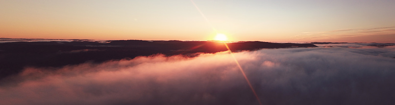 Panoramic Beautiful sunrise with fog rolling over mountain in autumn，Québec,canada