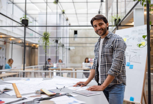 istock Happy business man working at the office 1357968010