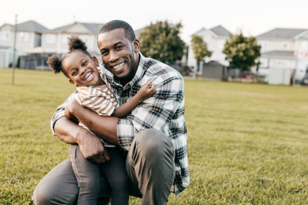 istock Happy child and dad outside 1357968684
