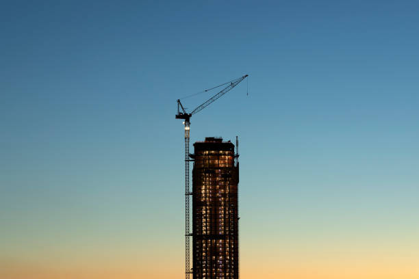 建築工事開発 - crane tower crane construction silhouette ストックフォトと画像