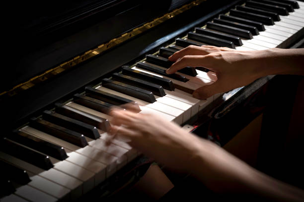 istock Hands Playing Piano Close-up Shot 1357973664