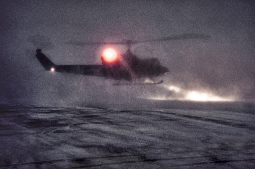 Crew Helicopter Landing at Oil Rig  in Snow Storm