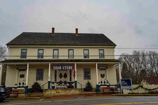 Zoar, Ohio, USA – December 3, 2021:  Zoar Village  Store decorated for Christmas. 25th US President William McKinley frequently visited. Zoar Village was one of the most successful communal settlements in American history. In 1817, German settlers, who separated from the Lutheran Church, founded Zoar in Ohio, USA.
