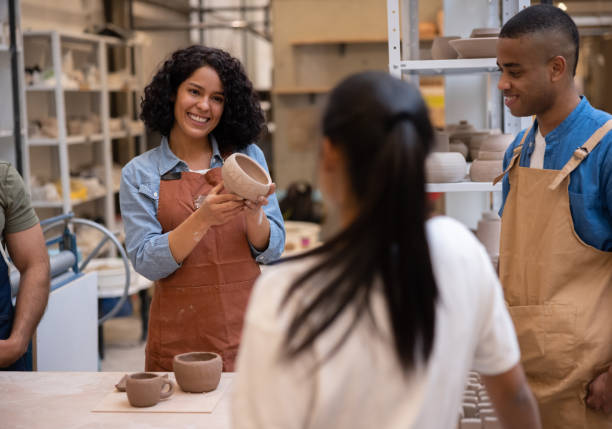 Teacher looking very happy in a pottery class