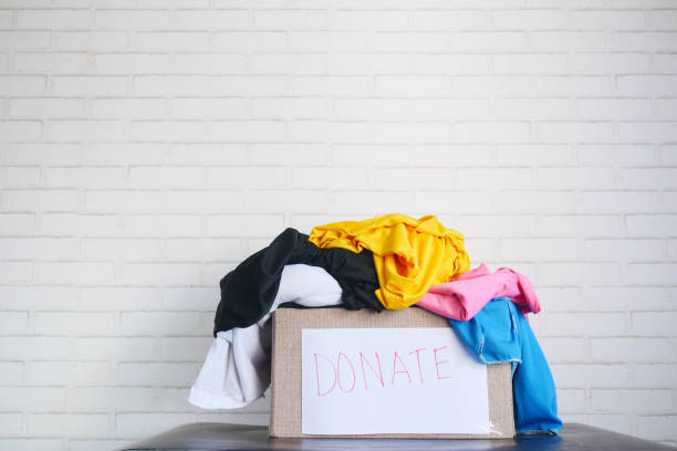 istock Donation box with donation clothes on table with copy space 1357979022