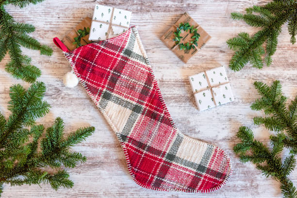 istock Holiday flat lay with Christmas stocking 1357984465