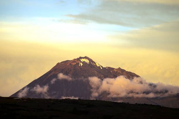 tungurahua volcano during sunset golden sunset next to the tungurahua volcano mt tungurahua sunset mountain volcano stock pictures, royalty-free photos & images