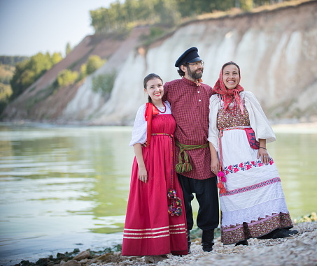 https://media.istockphoto.com/id/1357989130/photo/a-man-and-two-women-in-russian-national-costumes-pose-for-the-camera-on-the-background-of-an.jpg?b=1&s=170667a&w=0&k=20&c=sX5PgcllWZydVWEDFAjjr1BLNxXLZ5AVQ0WG-aAuVqw=