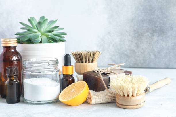 istock Wooden bamboo brushes, baking soda, lemon, essential oils, vinegar. Zero waste eco friendly cleaning concept. Copy space for your text 1357996828