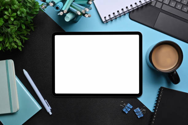 istock Above view creative designer workspace with digital tablet, laptop and supplies. 1357999275