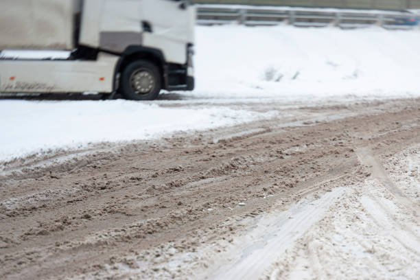 istock dirty sludgy road 1358003495