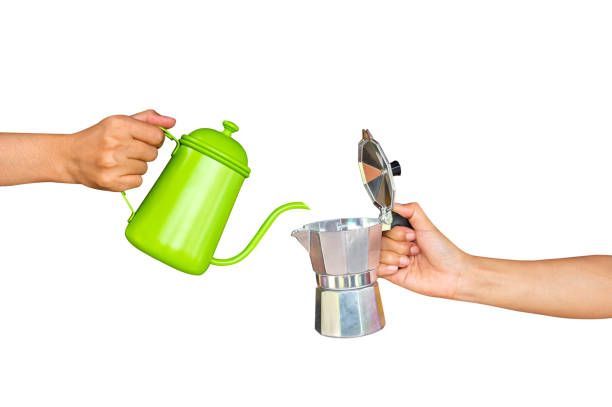 istock Hand hold kettle for making coffee by hand  isolated on white background 1358003525