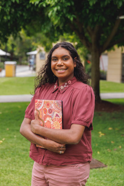 istock Female Aboriginal Australian Student Holding Laptop 1358004806