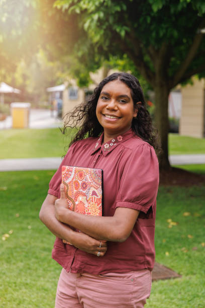 istock Female Aboriginal Australian Student Holding Laptop 1358004807