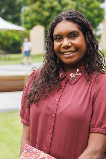 istock Female Aboriginal Australian Student Holding Laptop 1358004926