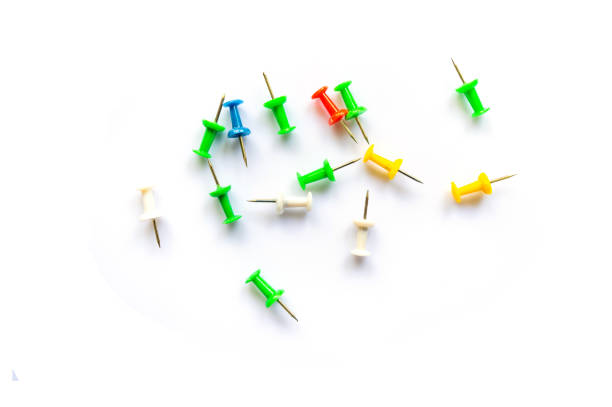 istock Group of colorful pins  on white background  with copy space 1358005850