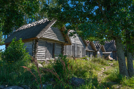 Idyllic wooden historic houses in Altja fishing village, northern Estonia. Altja is a typical seaside village, with all of its houses stretching along one street. The village was first mentioned in written records in 1465. Lahemaa National Park, Estonia 10.08.2020