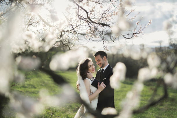 istock Bride and groom in the green forest 1358008395