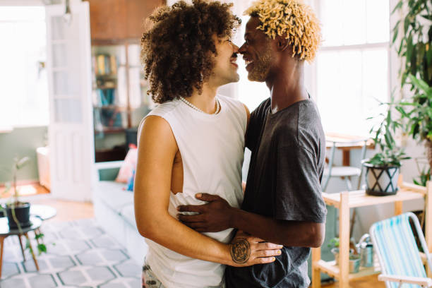 istock Romantic young gay couple embracing each other 1358008458