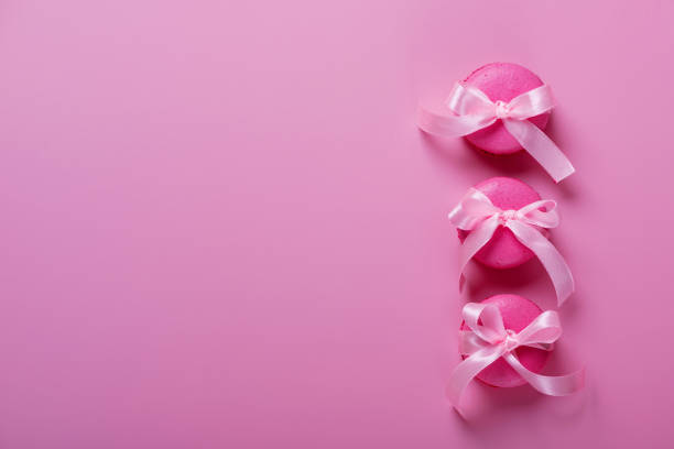 istock Pink macaroons on pink background. Sweet background. Flat lay, top view, copy space 1358009559