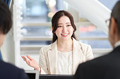 Asian business woman explaining at a meeting