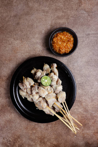 istock Sate taichan or taichan satay is a variation of chicken satay which burned without peanut or ketchup seasoning unlike other satays, usually served with hot sambal. 1358012795