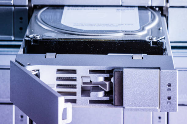 istock detail of hard disk in a tray that is being installed inside dat 1358012849