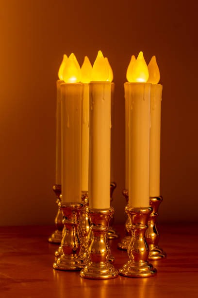 istock Defocused flameless candlestick lights illuminating a darkened room 1358014256