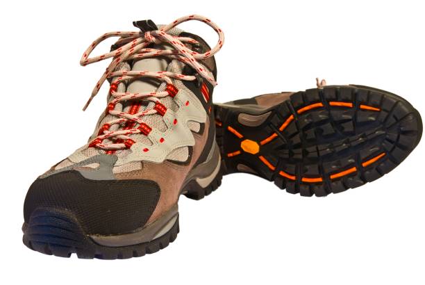 istock pair of touristic boots on a white background 1358015374