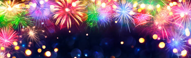 istock Fireworks - Anniversary Celebration With Colorful Lights In Blue Night With Glittering - Abstract Defocused Bokeh 1358024738