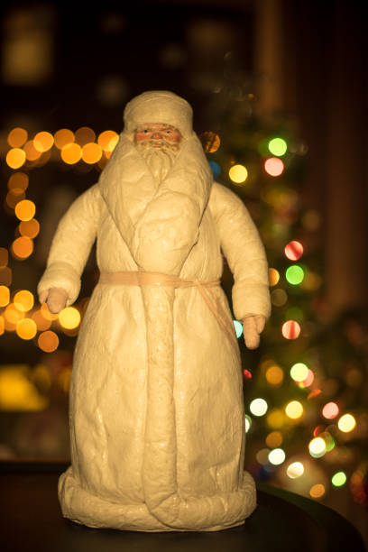 istock Santa Claus and Christmas tree 1358024777