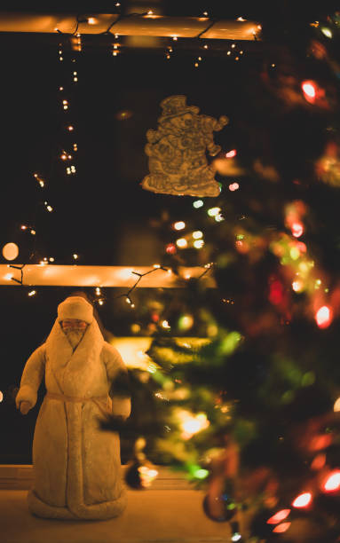 istock Santa Claus and Christmas tree 1358024916