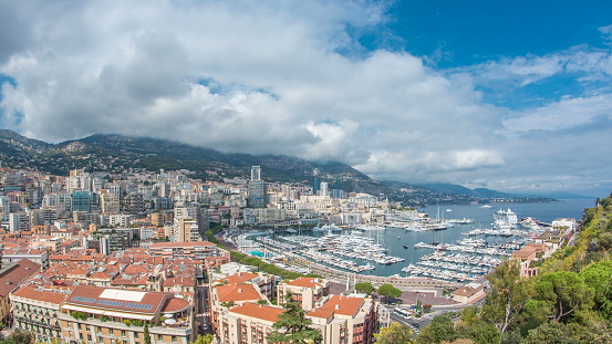 Monte Carlo city aerial panorama timelapse. Port Hercule. View of luxury yachts and apartments in harbor of Monaco, Cote d'Azur.