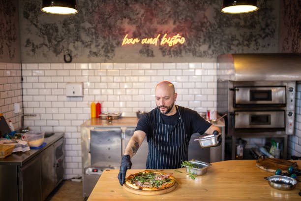 In the modern fast food restaurant chef making pizza
