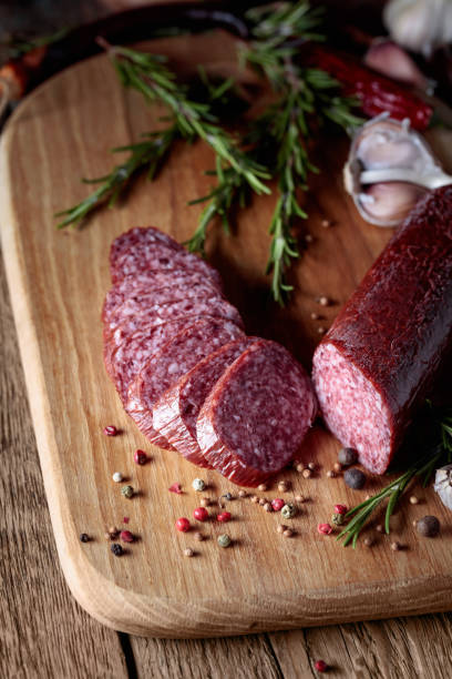 istock Sausages with rosemary, garlicand pepper. 1358032324